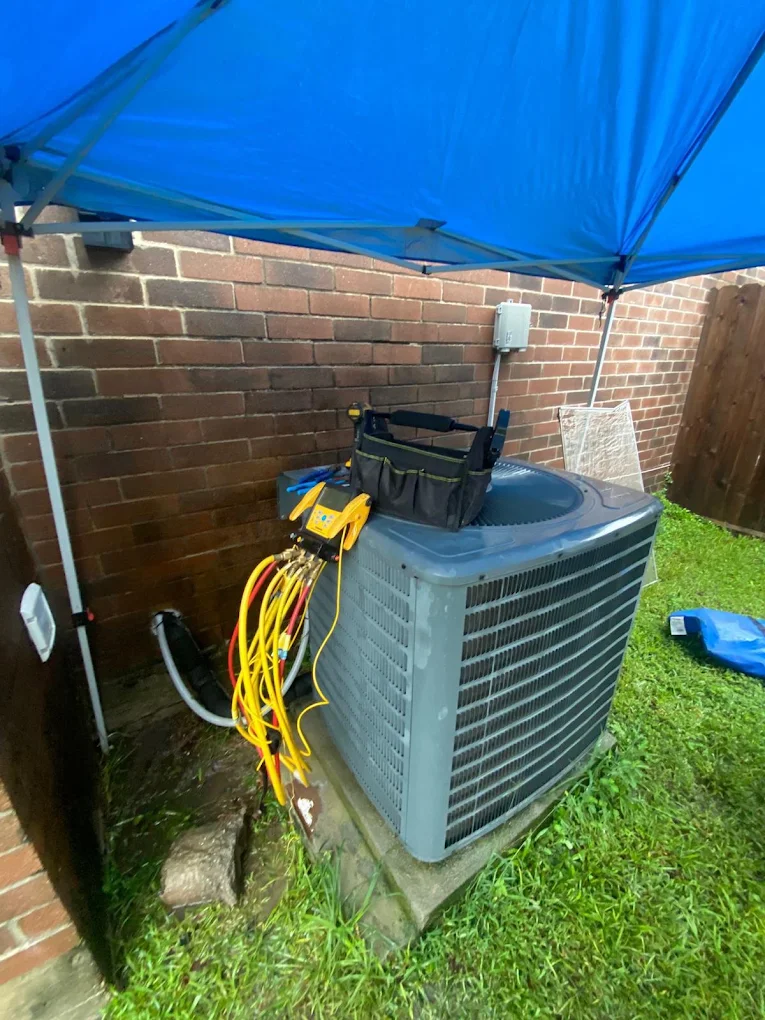 HVAC technician performing central air conditioning repair and diagnostics in Texas
